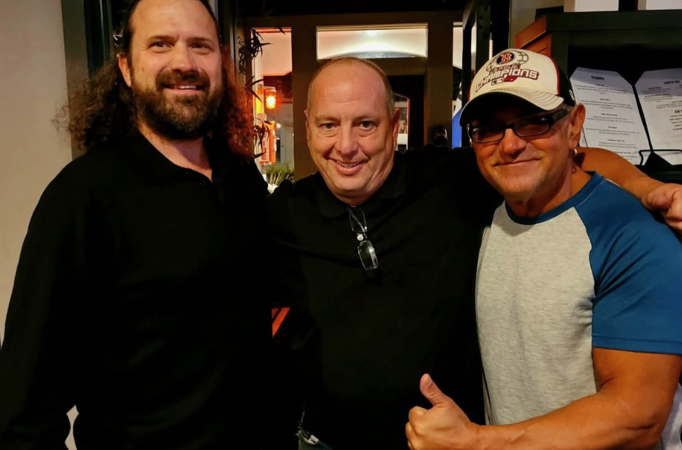 AM Station band photo featuring Dave Levine, James Richard, and Kenny Isaacs